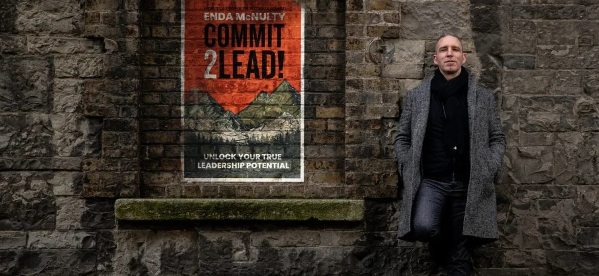 Professional by 'Commit 2 Lead' poster, symbolising McNulty's team performance coaching.